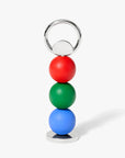 Areaware Abaco bottle opener in red, green, blue on a white background.