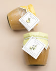 Close-up of Key Lime and Meyer Lemon curd-style spread jars with hang tags