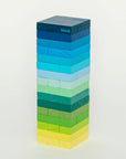 Gradient Tower stacking game in blue, teal, green and yellow wood blocks on white