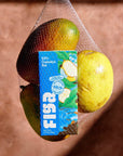 Figa cupuacu bar in a mesh produce bag with mangoes