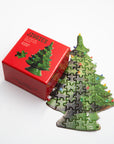 Jiggies mini puzzle shaped like a green ceramic Christmas tree, beside its red box