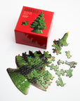 Christmas tree Jiggies mini puzzle in progress with loose pieces and its red box