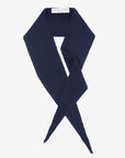 Laolao Studios cashmere mini scarf in navy, crossed in a loose loop on white