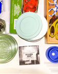 Collection of kitchen items including jars, a box, and Mayron's Goods kitchen soap.