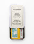 Open Mayron's Goods Pocket Aid Kit tin showing bandages and first aid packets