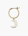 Daydreamer twisted gold hoop with a white porcelain crescent moon and painted gold stars