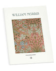 William Morris Florals coloring book standing upright with its pink floral cover