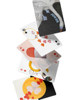 Set of playing cards with various designs on a white background