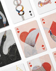 Hilma af Klint playing cards with artistic designs on a white background
