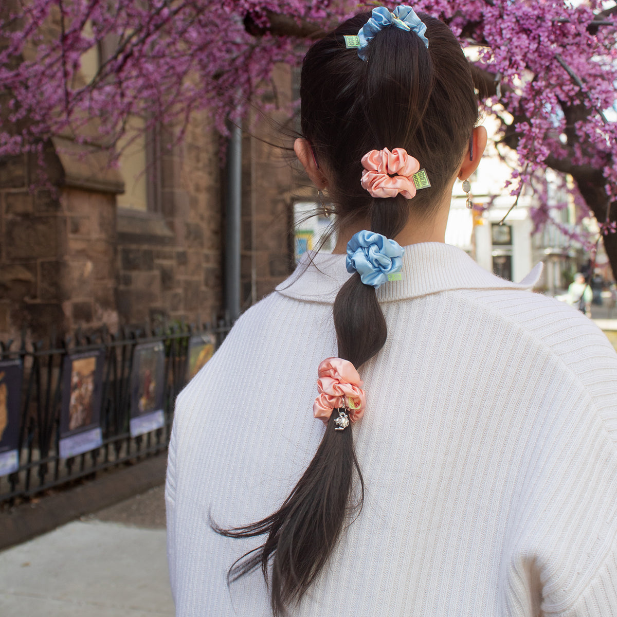 girl wearing pink and blue baby satin scrunchies in a bubble b raid