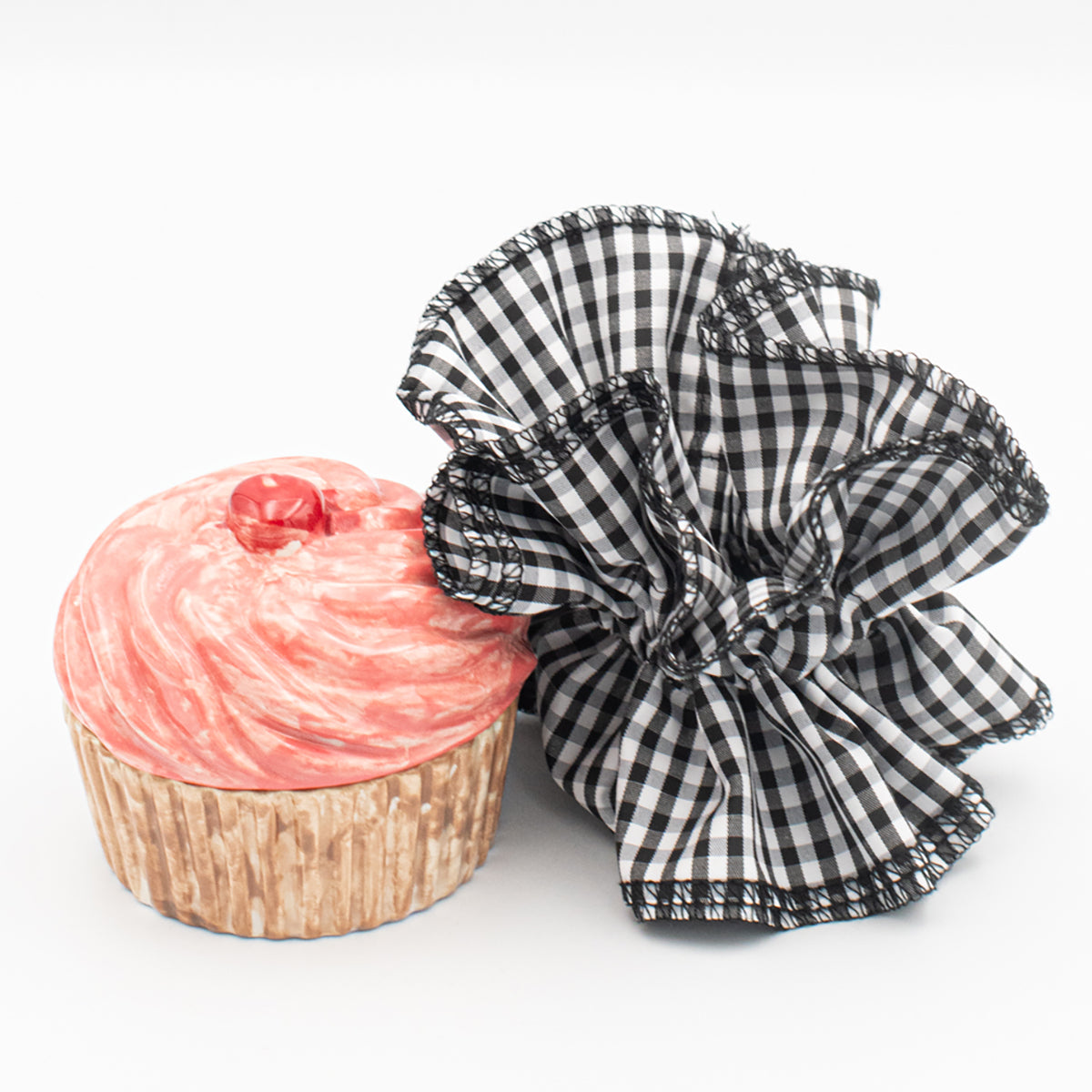 gingham ruffle scrunchie next to a cupcake
