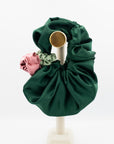 Emerald satin clutch bag with matching rosette hair ties in antique rose and sage green.