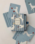 Roomytown Dogs playing card deck in a blue striped box with cards showing cream dog silhouettes