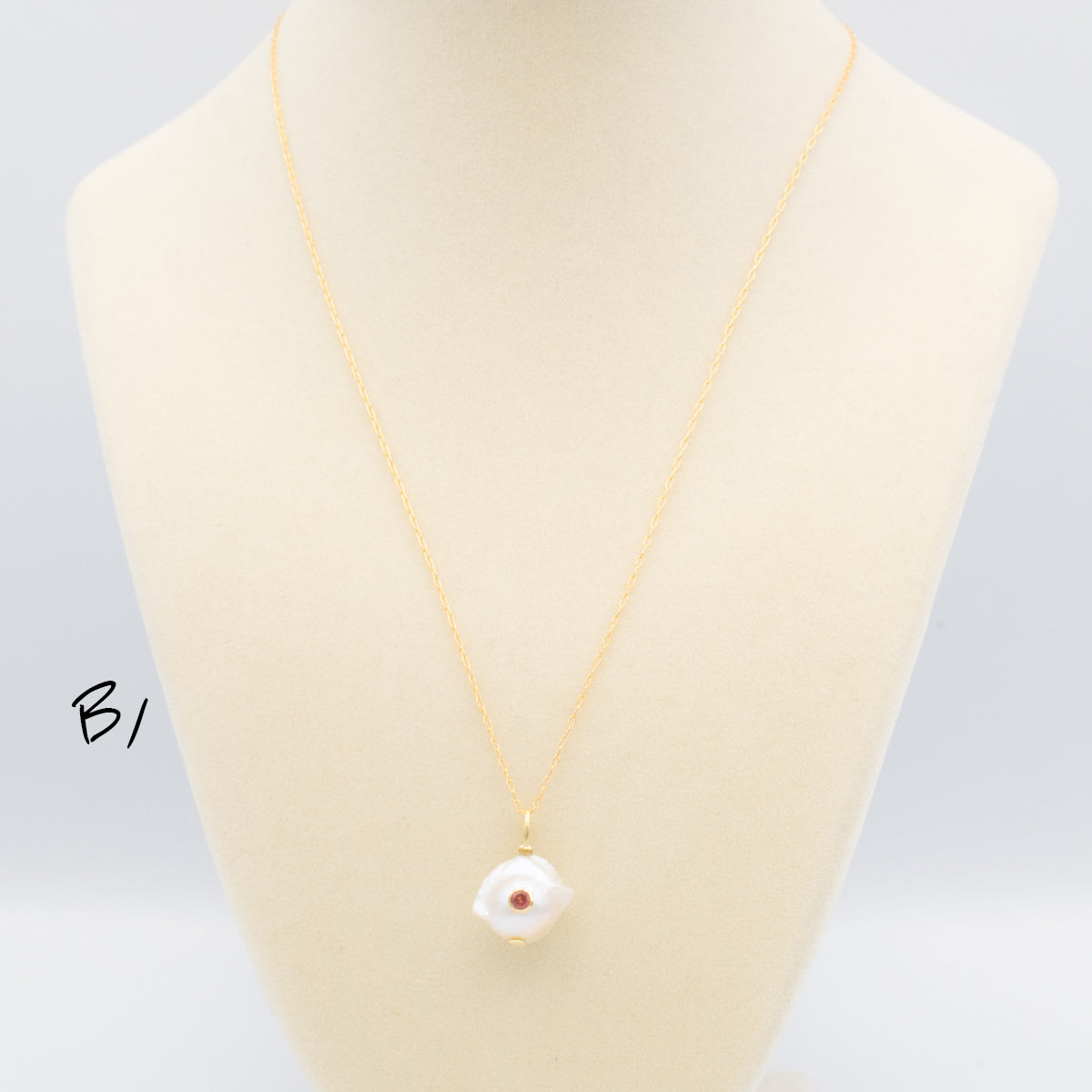Baroque Pearl Pendant With Set-In Gemstone