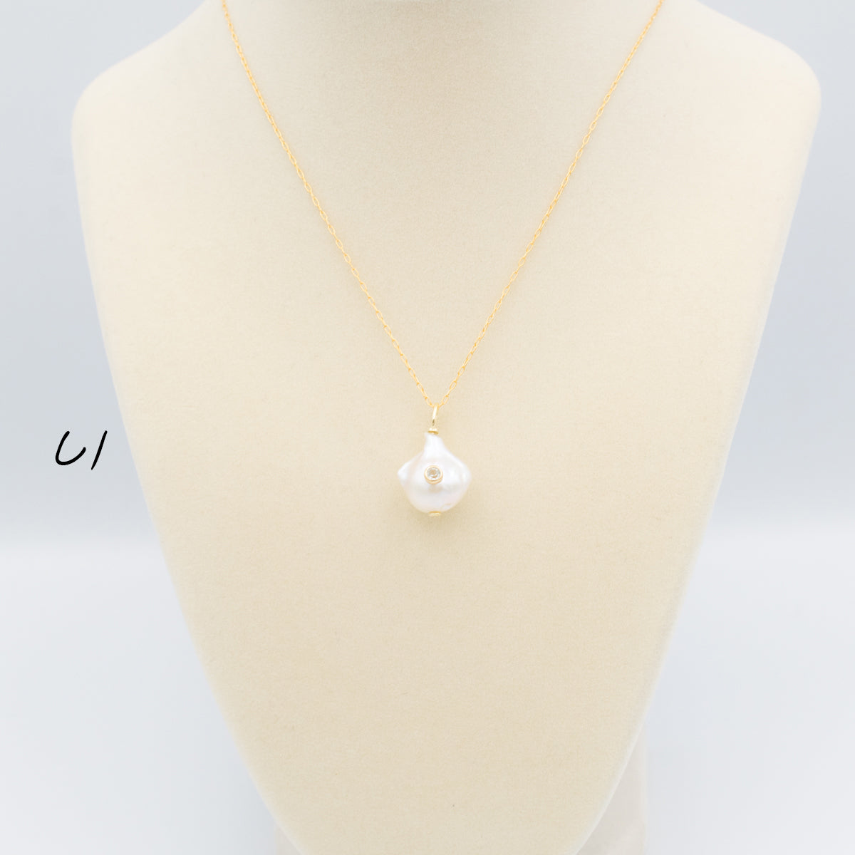 Baroque Pearl Pendant With Set-In Gemstone