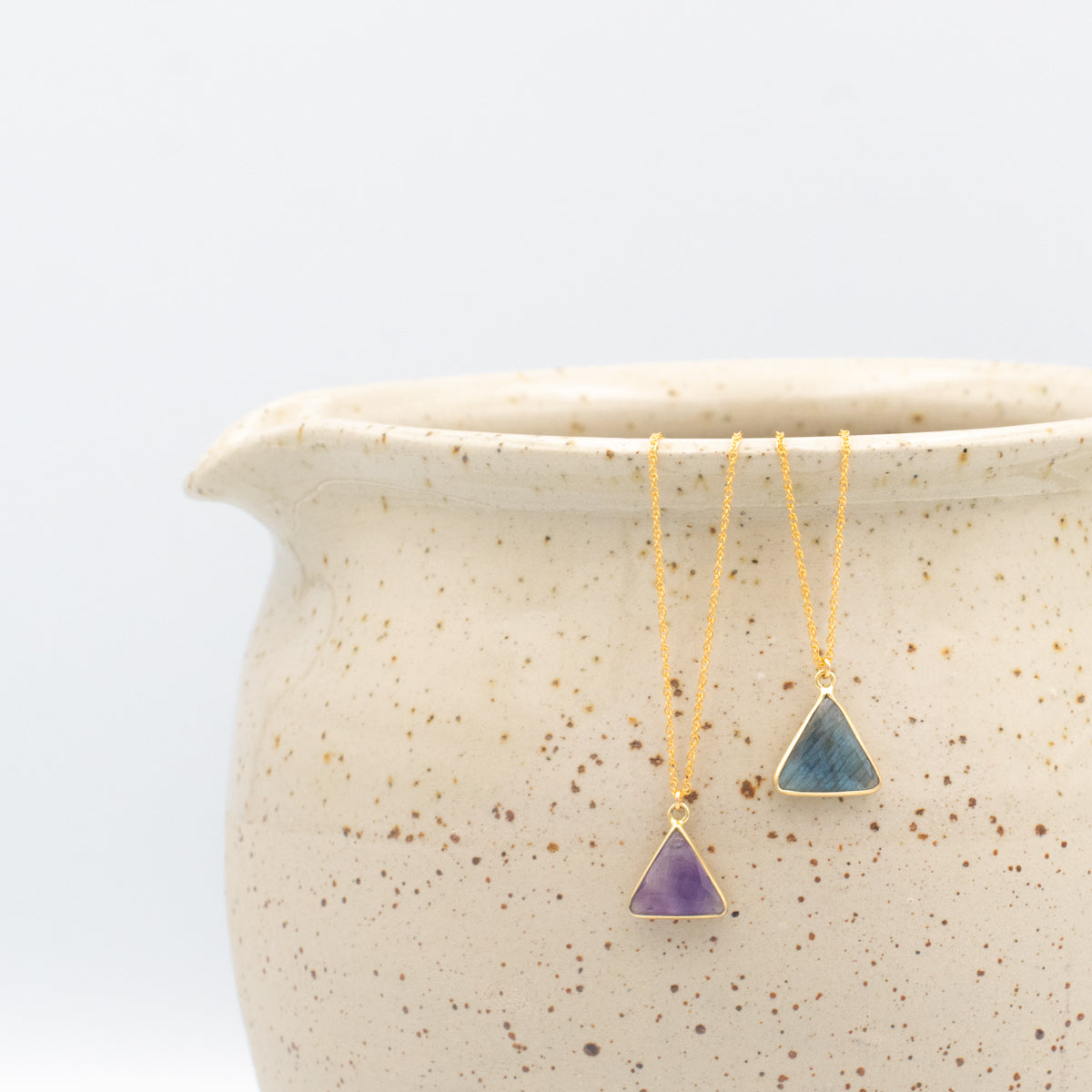amethyst and labradorite triangle gemstone necklaces on a gold-filled chain