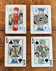 Four Ski House Games kings illustrated as skiers and snowboarders on a wooden table