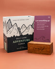 Self Care Adventure Cards box with a Let Something Go card in a wooden stand