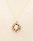 Close up of shell cameo in 10K gold-filled Etruscan Revival frame with forget-me-not accents on 18" gold-filled chain