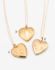 Three vintage, gold-filled, heart shaped lockets labeled (C, D, E) with varied engravings.