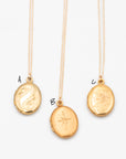 Three vintage oval gold lockets (A, B, C) featuring scroll, starburst, and floral engravings