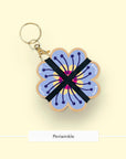 Studio Wald flower press keychain in the Periwinkle design with a gold clasp
