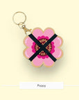 Studio Wald flower press keychain in the Poppy design with pink and red petals