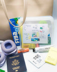 The TME Flight Kit — long-haul travel essentials in a clear TSA-friendly silicone pouch.