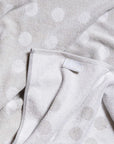 Close-up of small business Typical's terry cloth stretchy polka dot towel.