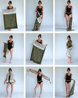 Woman demonstrating the versatility of a green and white polka dot stretchy terry cloth towel in various poses.