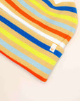 Close-up of the Verloop beanie's bright stripes and small woven logo tab