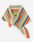 Verloop striped triangle scarf tied in a knot, in tan, orange, blue and chartreuse