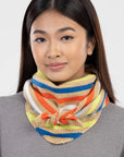 Model wearing the Verloop triangle scarf bandana-style, knotted at the front