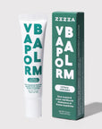 Zizia Vapor Balm tube beside its dark green box