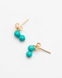 88.6.4 turquoise double bead stud earrings with 14K gold-filled posts and butterfly backs on white background