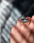 Close-up of a hand wearing the East/West quartz statement ring in solid sterling silver.