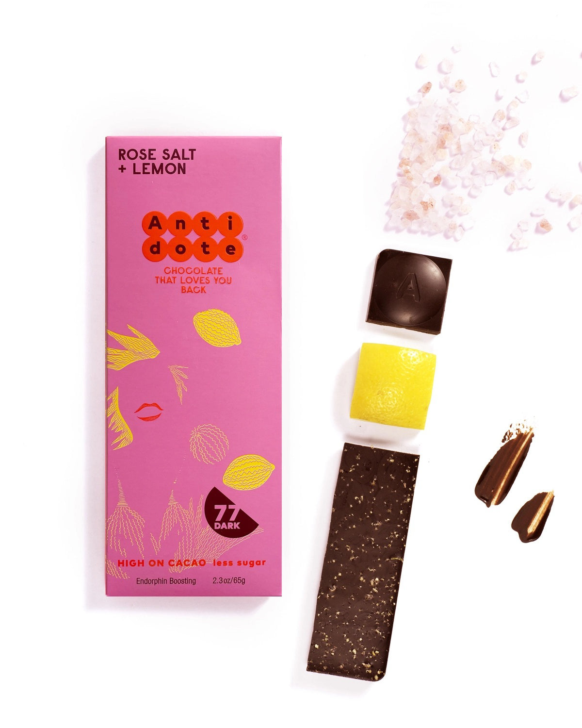 Antidote Rose Salt and Lemon Peel 77% dark chocolate bar in pink wrapping with a broken bar