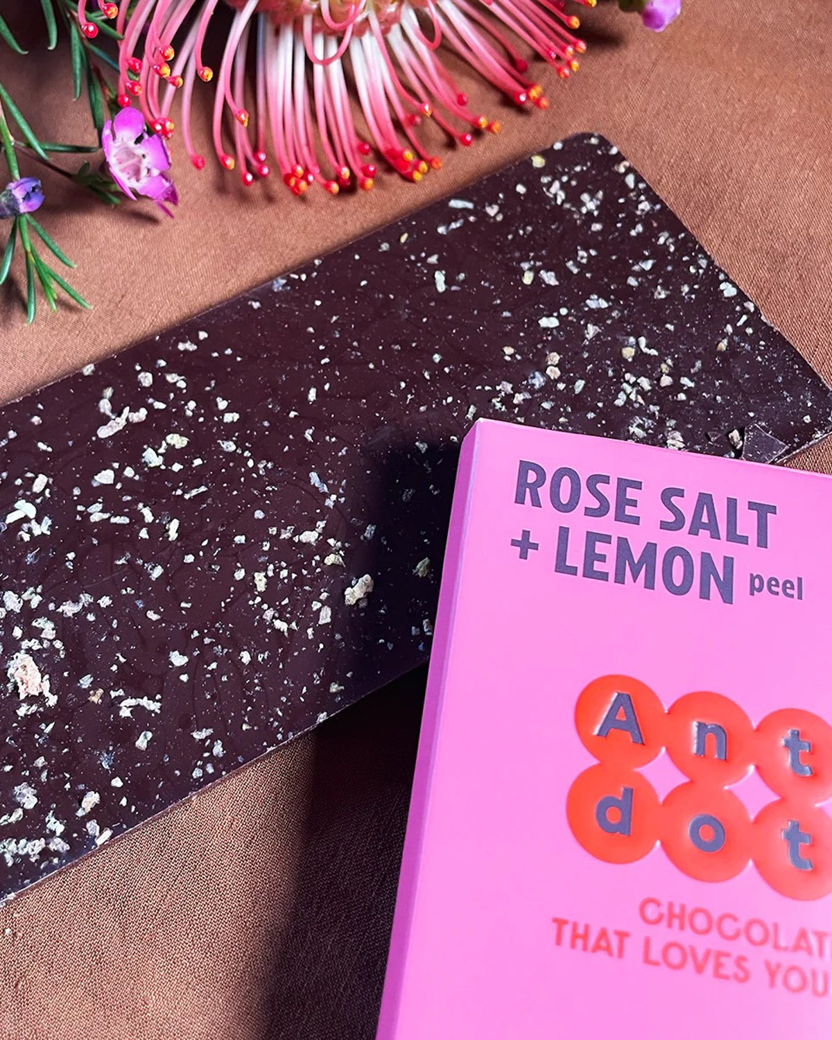 Antidote Rose Salt and Lemon bar unwrapped, dark chocolate flecked with pink salt