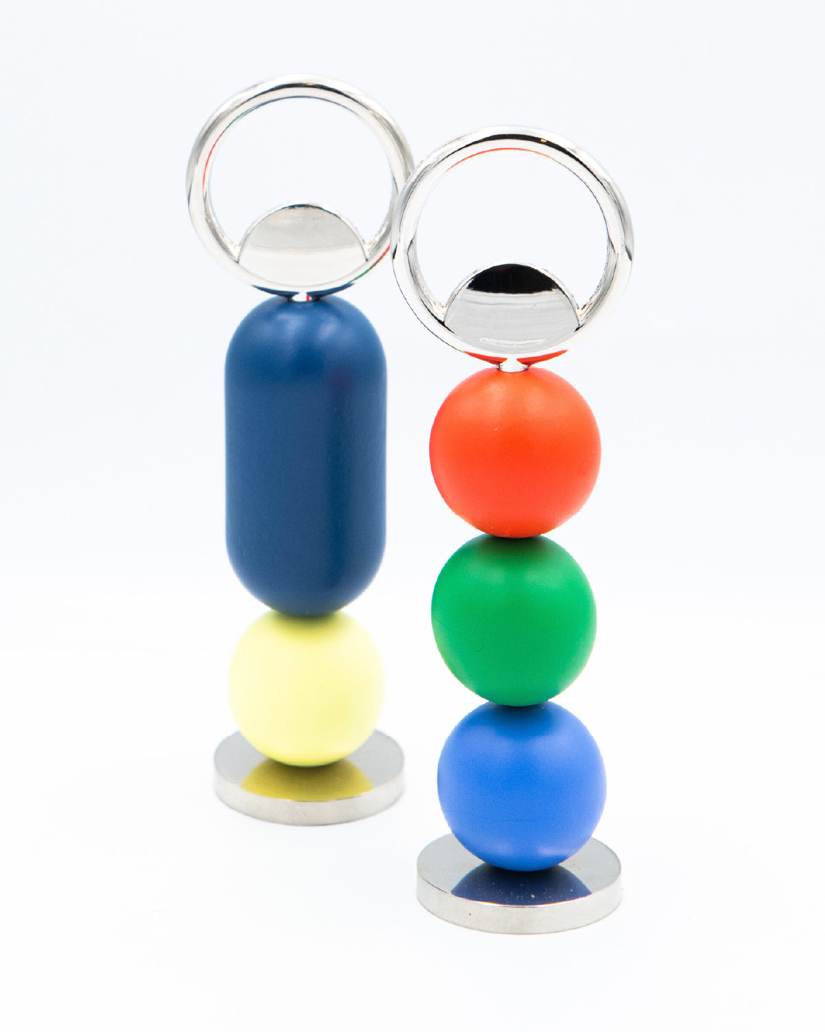 Colorful bottle openers on a white background.