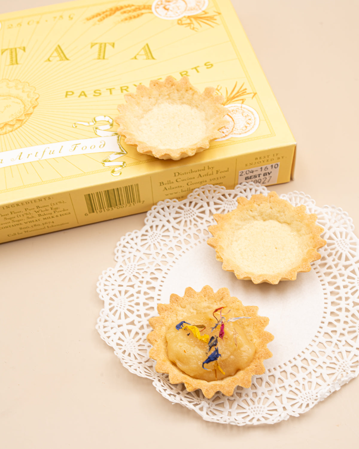 Bella Cucina Crostata box with mini tart shells, one filled and topped with flower petals