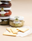 Bella Cucina pesto jars with olive oil crackers on a lace doily