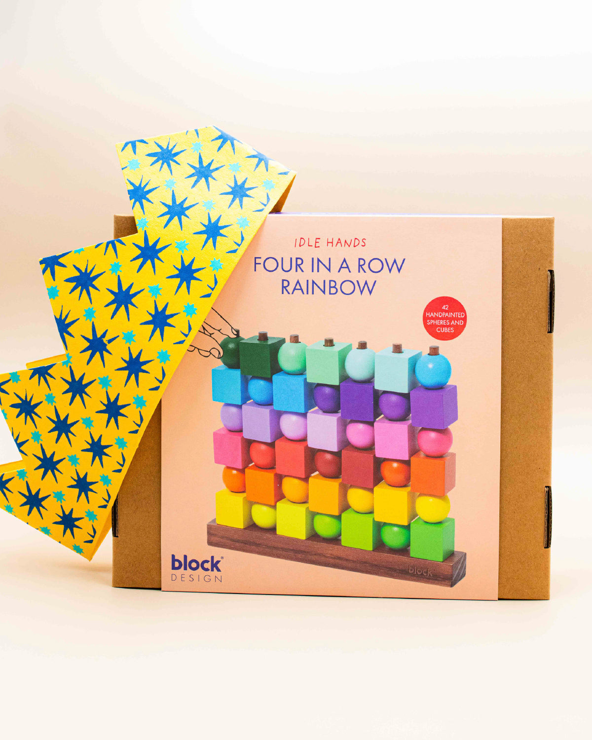 Block Design Four in a Row Rainbow boxed game with wooden cubes and balls on the front