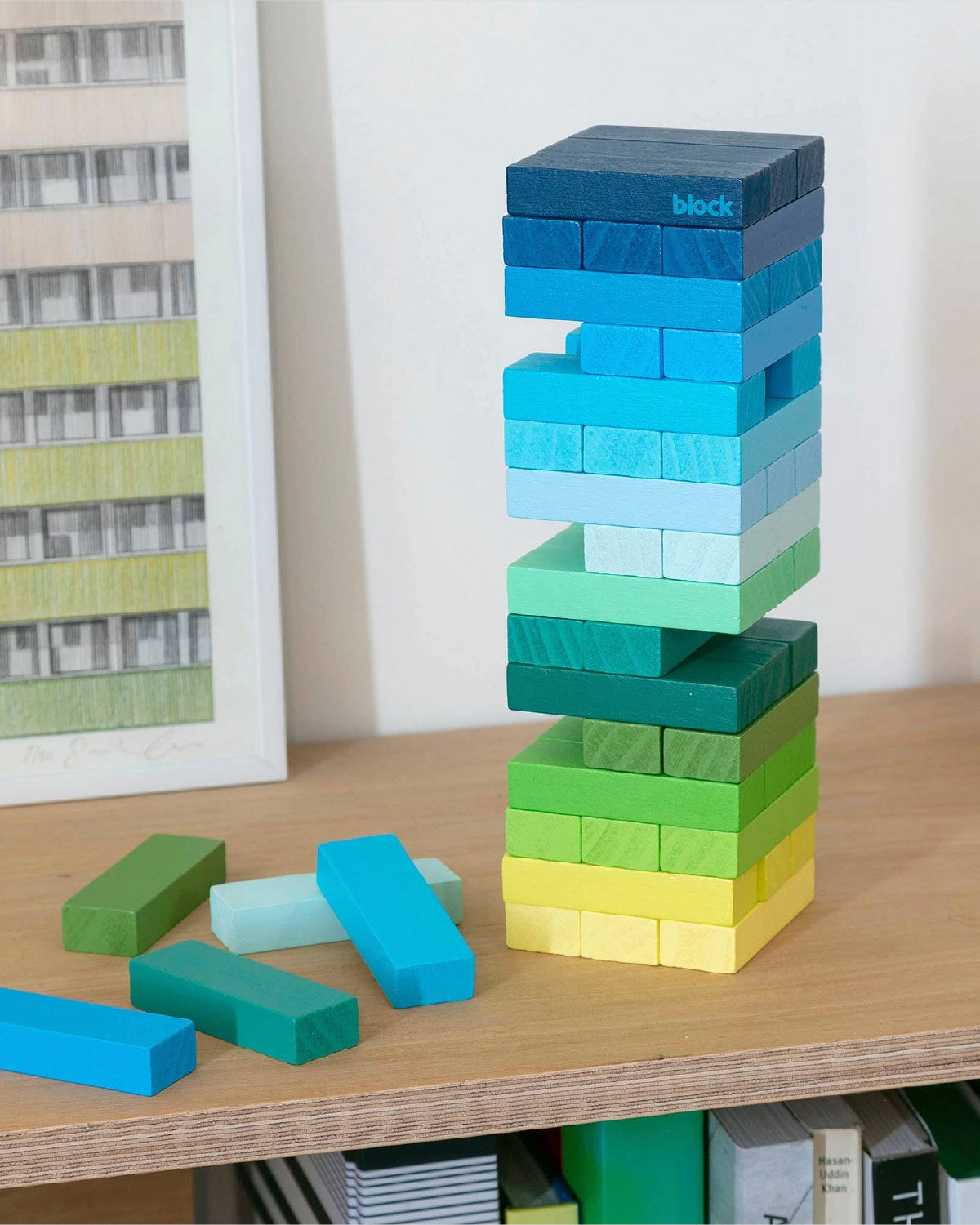Gradient Tower mid-game with blocks pulled out, loose blue and green blocks nearby