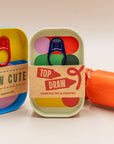 Block Design tins with Top Draw drawing pad and crayons label beside a Sew Cute sewing tin
