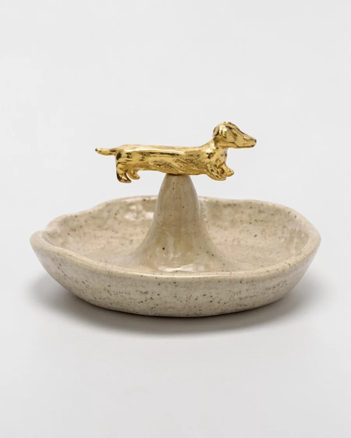 CÂPÂ speckled ceramic jewelry dish topped with a gold-plated dachshund