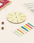 Wooden weaving disc, two wooden beads and a card of pastel cotton thread