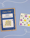 Cotton Twist Game of Picaria packaging and board on a periwinkle background