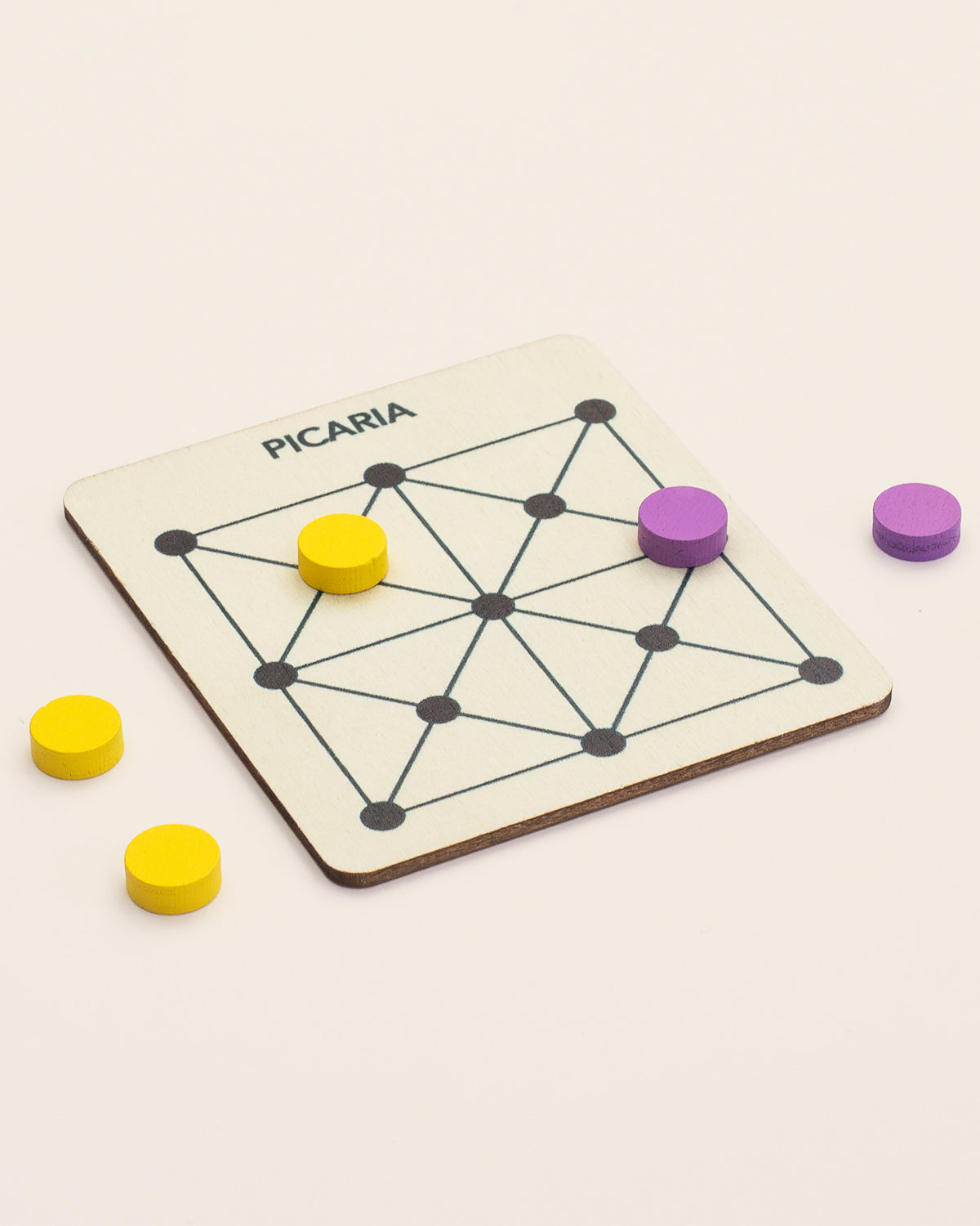 Square wooden Picaria board with yellow and purple tokens