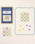 Cotton Twist Game of Picaria kit: blue envelope, wooden board and yellow and purple tokens