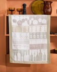 Sommelier jacquard kitchen towel with wine glasses, corkscrews and bottles hung on a shelf